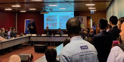 Lars Ystanes (Equinor environmental advisor) speaking at the standing-room-only side event, with an IPEN supporter in the foreground
